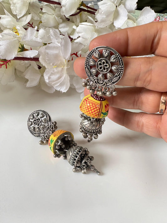 Hand-Painted Terracotta Jhumka Earrings
Antique Silver Jhumka Earrings | Handcrafted Folk Art Jewellery | Artisan Statement Earrings