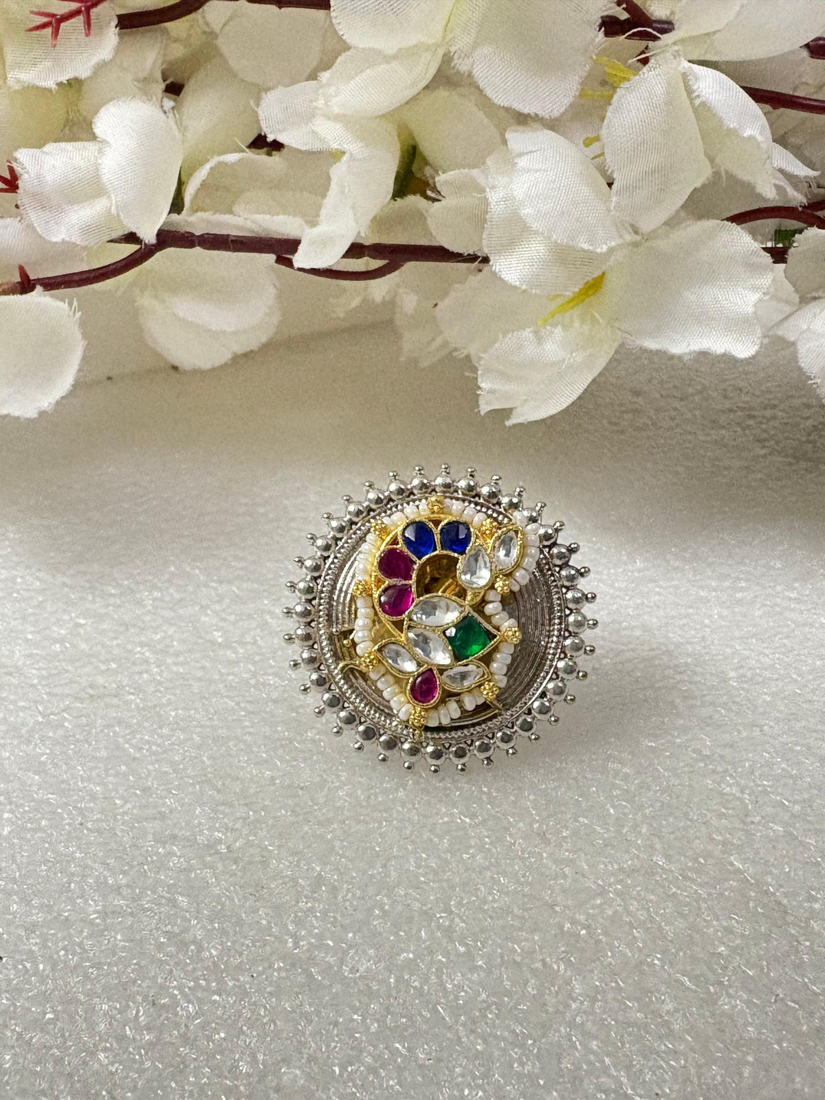 Mayurang Dual Tone Navratna Kundan Ring

Handcrafted Adjustable Statement Ring | Antique Silver & Gold Kundan Cocktail Ring | Heritage Fusion Jewellery
