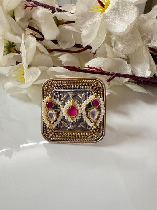 Rajvanshi Kundan Dual Tone Heritage Statement Ring

Handcrafted Dual Tone Kundan Cocktail Ring | Adjustable Designer Ethnic Ring | Pearl Detailed Heritage Jewellery